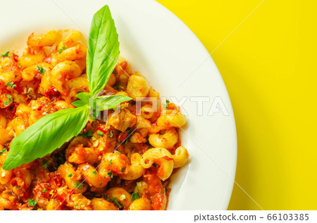 Cooked cellentani pasta with cooked chicken breast 66103385
