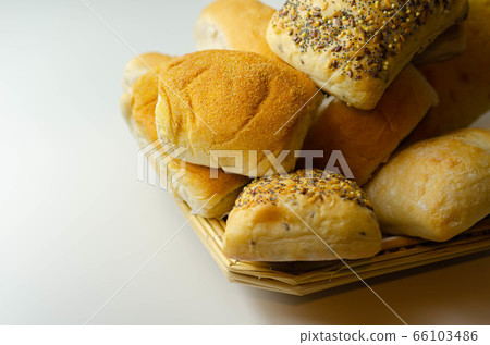 Various types of bread served on a wicker tray, 66103486