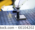 detail of 3d printer printing a plastic piece 66104202