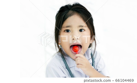 happy kids with red lollipop sweet candy 66104469