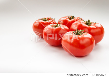 Tomato few vegetables on white background close up Tomato few vegetables on white background close up 66105873