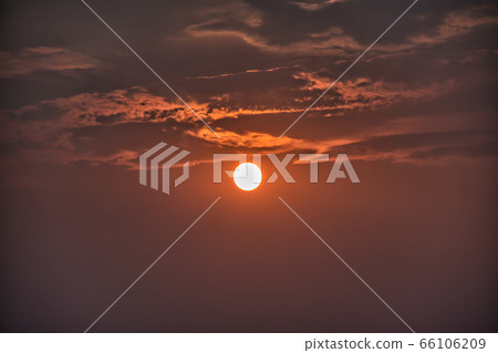 Sky with clouds during a golden sunset Sky with clouds during a golden sunset 66106209