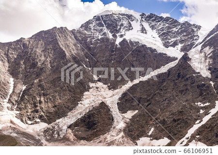 High snowy Caucasian mountains with a glacier with High snowy Caucasian mountains with a glacier with 66106951