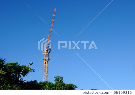 PERAK, MALAYSIA -FEBRUARY 02, 2016: Tower Crane used to lift the heavy load at the construction site in Perak, Malaysia    66109316