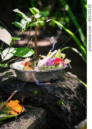 Traditional balinese offerings to gods in Bali 66110136