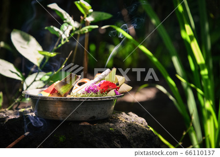 Traditional balinese offerings to gods in Bali 66110137