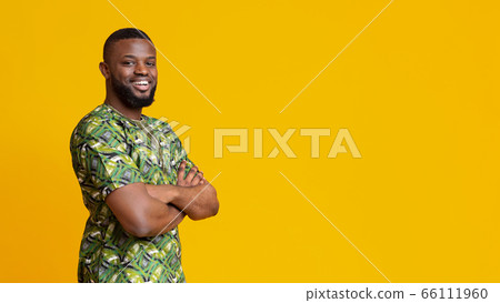 Confident black guy with arms crossed looking at camera Confident black guy with arms crossed looking at camera 66111960