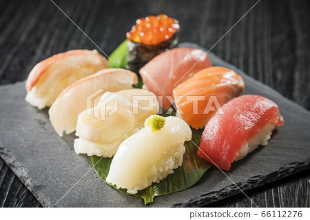 Assorted nigiri sushi on a black plate 66112276