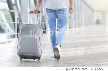 Unrecognizable Man Walking With Suitcase In Airport, Going To Boarding Gate 66112279