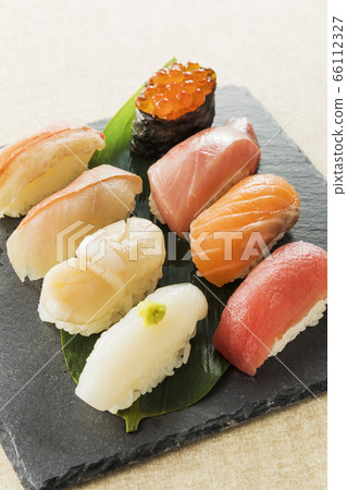 Assorted sushi on a black plate 66112327