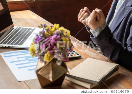 Picture of business woman pretending wisp hand because work success Picture of business woman pretending wisp hand because work success 66114679