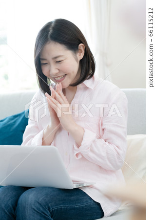 Middle woman computer remote mom meeting living Middle woman computer remote mom meeting living 66115212