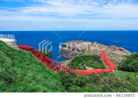 Motonosumi Shrine (Motonosumi Inari Shrine) with red torii gates on the background of the blue Sea of Japan Nagato City, Yamaguchi Prefecture Motonosumi Shrine (Motonosumi Inari Shrine) with red torii gates on the background of the blue Sea of Japan Nagato City, Yamaguchi Prefecture 66116953