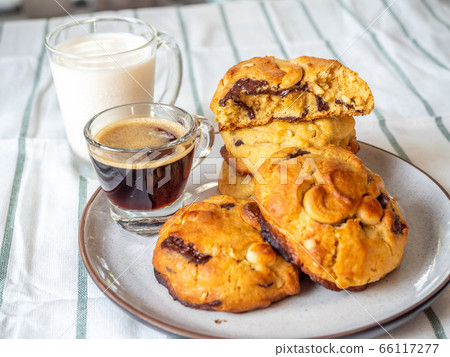 Chewy chocolate chip soft cookies with cup of 66117277