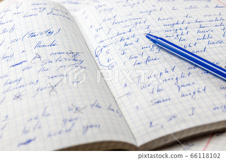 Sheets of school student notebook scribbled with a blue ballpoint pen. Sheets of school student notebook scribbled with a blue ballpoint pen. 66118102