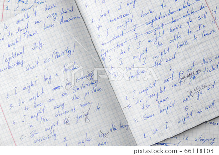 Sheets of school student notebook scribbled with a blue ballpoint pen. Sheets of school student notebook scribbled with a blue ballpoint pen. 66118103