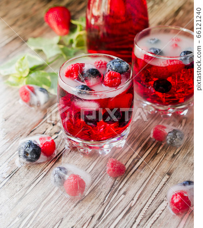 Summer berry lemonade with frozen berries on a 66121240