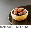 Ripe dates in a wooden bowl, Ramadan, Iftar time, 66121643