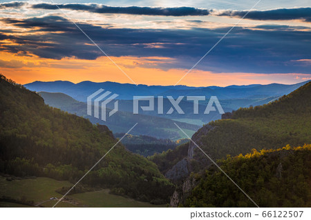 Mountainous landscape at sunset at spring time. Mountainous landscape at sunset at spring time. 66122507