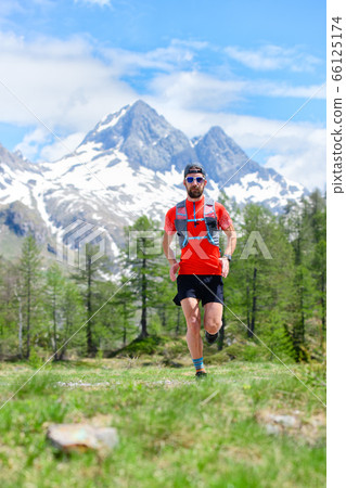 Trail running runner in the mountains 66125174