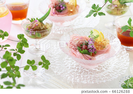 Refreshing plum somen, served individually on a glass plate, cooked with summer vegetables Refreshing plum somen, served individually on a glass plate, cooked with summer vegetables 66126288