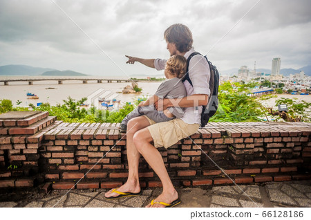 Father and Toddler Son tourists in Vietnam. Po Nagar Cham Tovers. Asia Travel concept. Father and Toddler Son tourists in Vietnam. Po Nagar Cham Tovers. Asia Travel concept. 66128186