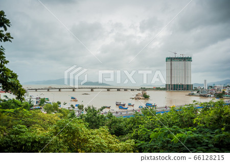 Beautiful view on Nha Trang and Bay of the South China Sea blue sky background in Khanh Hoa province at afternoon in Vietnam. is a popular tourist destination Asia. Beautiful view on Nha Trang and Bay of the South China Sea blue sky background in Khanh Hoa province at afternoon in Vietnam. is a popular tourist destination Asia. 66128215