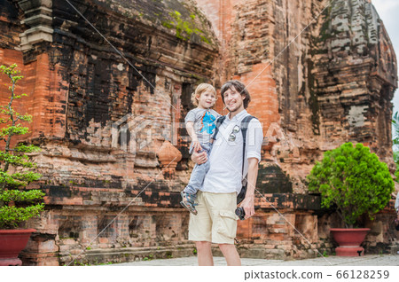 Father and Toddler Son tourists in Vietnam. Po Nagar Cham Tovers. Asia Travel concept. Father and Toddler Son tourists in Vietnam. Po Nagar Cham Tovers. Asia Travel concept. 66128259