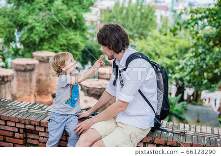 Father and Toddler Son tourists in Vietnam. Po Nagar Cham Tovers. Asia Travel concept. Father and Toddler Son tourists in Vietnam. Po Nagar Cham Tovers. Asia Travel concept. 66128290