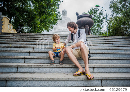 Happy tourists dad and son in LongSon Pagoda Happy tourists dad and son in LongSon Pagoda 66129679