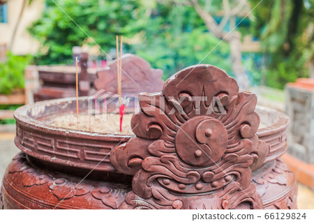 Buddhist prayer sticks inside temple 66129824