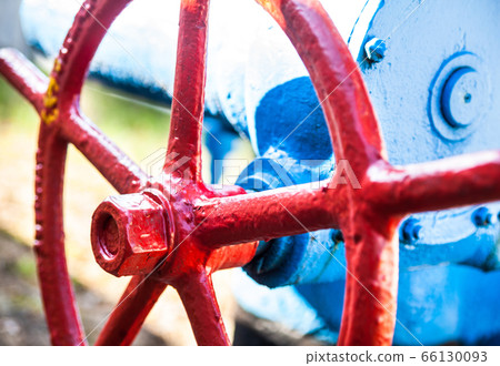 Red valve on the blue pipe. Red valve on the blue pipe. 66130093