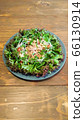 Tuna and bean salad placed on a wooden table (vertical position) 66130914