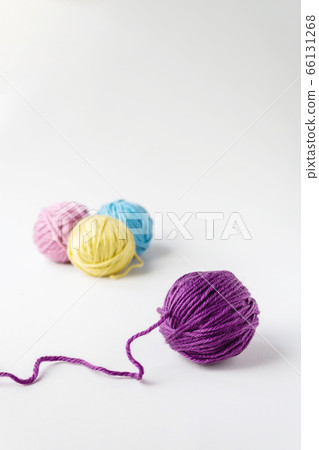 Close up photo of violet woolen ball. Close up photo of violet woolen ball. 66131268