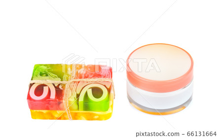 Cosmetic cream and handmade soap isolated on white 66131664