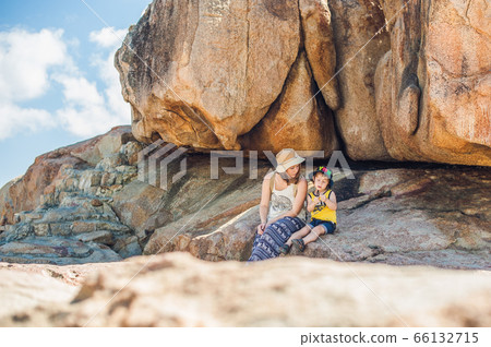 Mother and son travelers at the Hon Chong cape, Garden stone, popular tourist destinations at Nha Trang. Vietnam 66132715