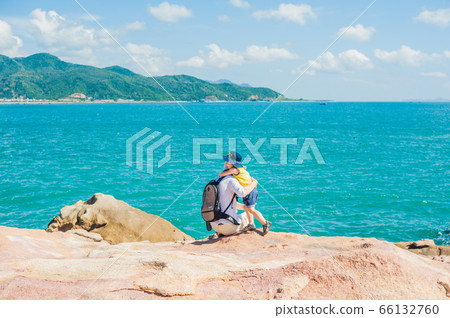 Father and son travelers at the Hon Chong cape, Garden stone, popular tourist destinations at Nha Trang. Vietnam 66132760