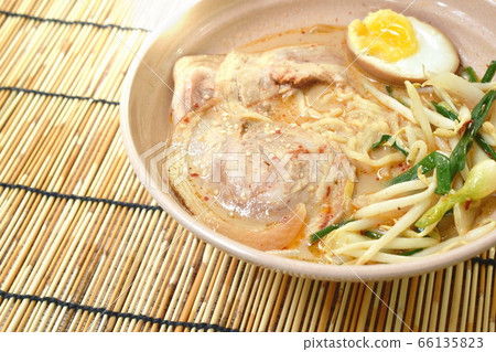 miso ramen or Japanese yellow noodles topping slice braised pork in soybean soup on bowl miso ramen or Japanese yellow noodles topping slice braised pork in soybean soup on bowl 66135823