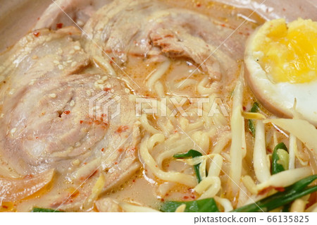 miso ramen or Japanese yellow noodles topping slice braised pork in soybean soup on bowl 66135825