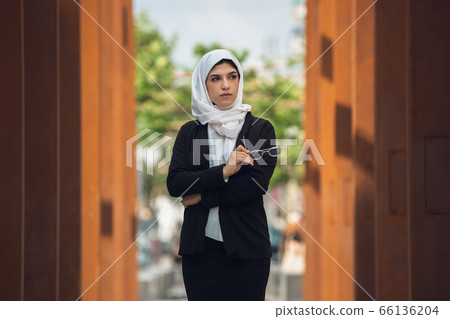 Beautiful muslim successful businesswoman portrait, confident happy CEO 66136204