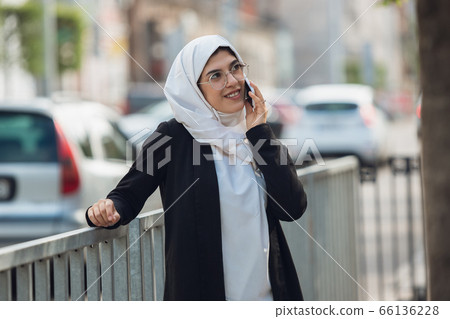 Beautiful muslim successful businesswoman portrait, confident happy CEO 66136228