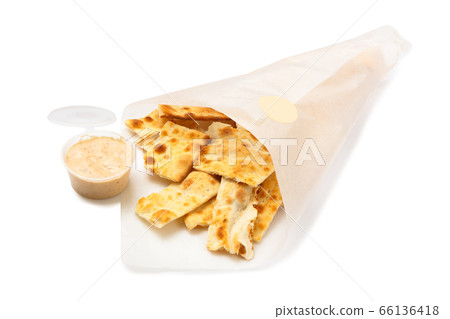 Salted crackers in a paper bag isolated on white 66136418