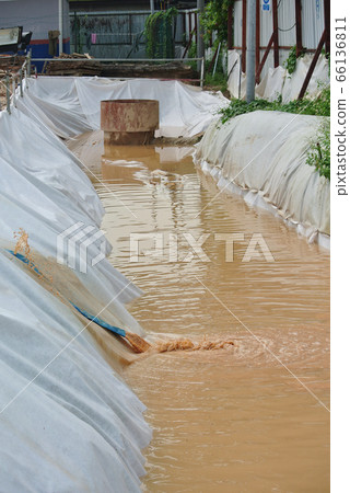 MALACCA, MALAYSIA -OCTOBER 26, 2015: Check dam or silt trap at the construction site. Soil and mud from the construction site in strained and precipitated. Only clean water discharged.  66136811