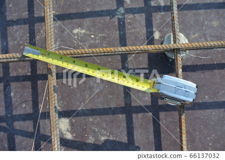 JASIN, MALAYSIA -MARCH 10, 2016: Measuring tape used at the construction site.  66137032