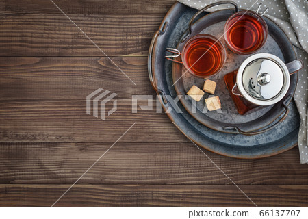 Two glass cup of tea with teapot 66137707