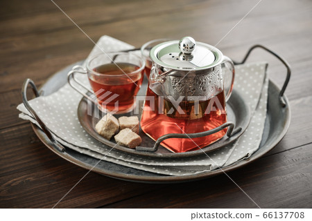 Two glass cup of tea with teapot Two glass cup of tea with teapot 66137708