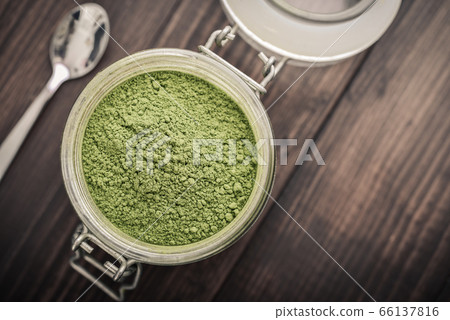 Moringa powder in glass jar Moringa powder in glass jar 66137816