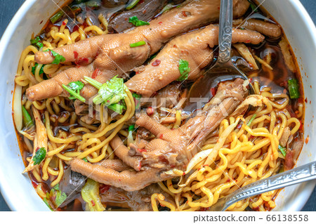 Braised chicken soup with bitter gourd noodle. 66138558