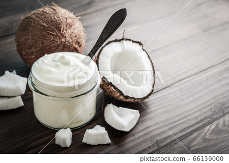 Coconut cream in a glass jar with fresh coconut Coconut cream in a glass jar with fresh coconut 66139000
