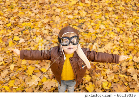 Happy child having fun outdoor in autumn park 66139039